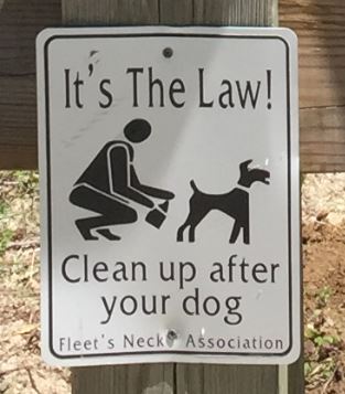 Pick up your pet waste sign posted be the Fleet's Neck Association.